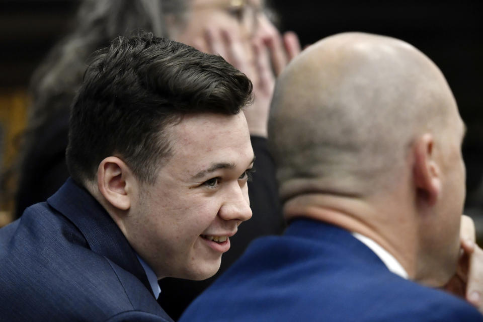 Defendant Kyle Rittenhouse speaks with his attorneys before the jury is relieved for the day during his trial at the Kenosha County Courthouse in Kenosha, Wis., on Thursday, Nov. 18, 2021. (Sean Krajacic/The Kenosha News via AP, Pool)