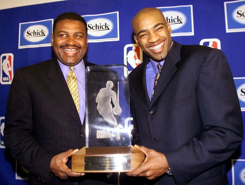 FILE PHOTO: Toronto Raptors' Vince Carter with coach Butch Carter after receiving the NBA Rookie of the Year award.