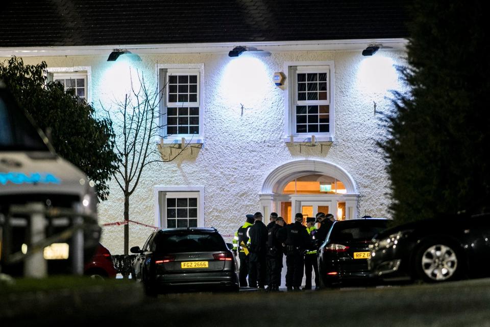 Police at the entrance of the Greenvale Hotel (PA)