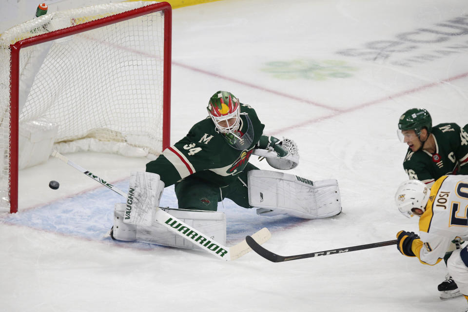 Nashville Predators defenseman Roman Josi (59) shoots a goal past Minnesota Wild goaltender Kaapo Kahkonen (34) in the first period of an NHL hockey game, Sunday, Oct. 24, 2021, in St. Paul, Minn. (AP Photo/Andy Clayton-King)