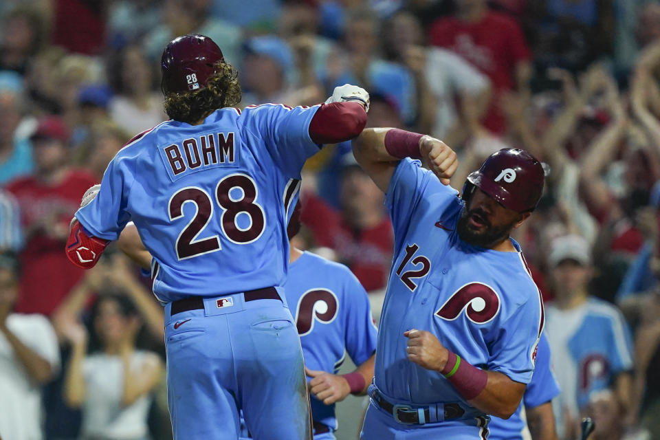 Philadelphia Phillies' Alec Bohm, left, celebrates with Kyle Schwarber, after hittung a home run off of Washington Nationals' Paolo Espino during the third inning of a baseball game, Thursday, Aug. 4, 2022, in Philadelphia. (AP Photo/Matt Rourke)