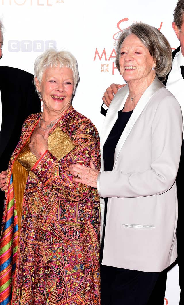 Dame Judi Dench and Dame Maggie Smith smiling