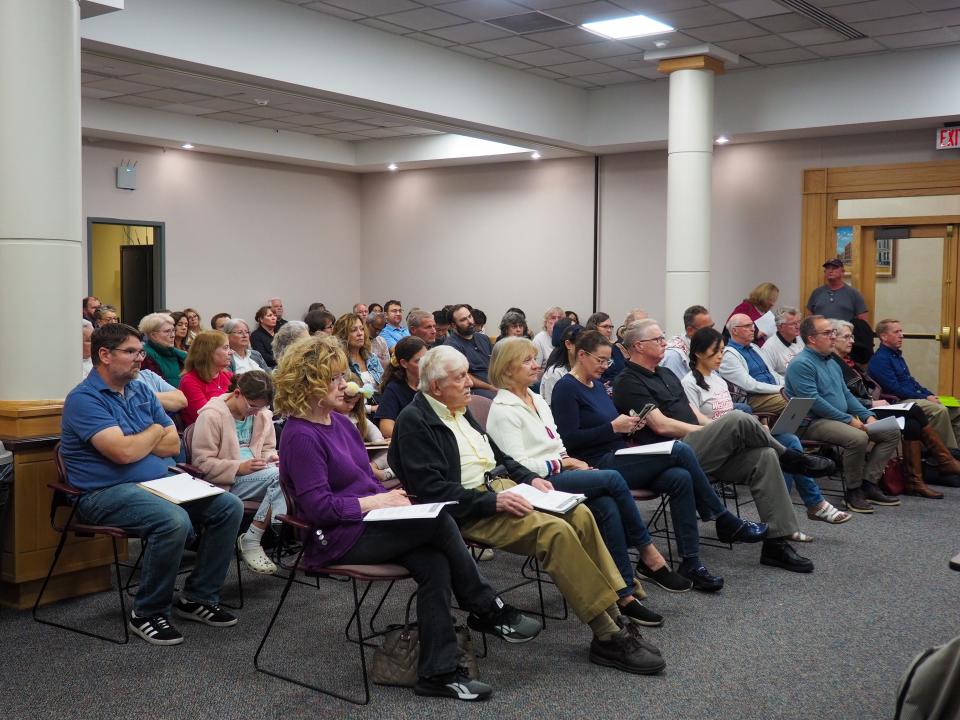 A crowd of concerned neighbors share their displeasure of the board's willingness to approve special exceptions to allow homeowners to turn their properties into Airbnb at the Tippecanoe County Area Board of Zoning Appeals meeting, on Wednesday, Oct. 25, 2023, in Lafayette.