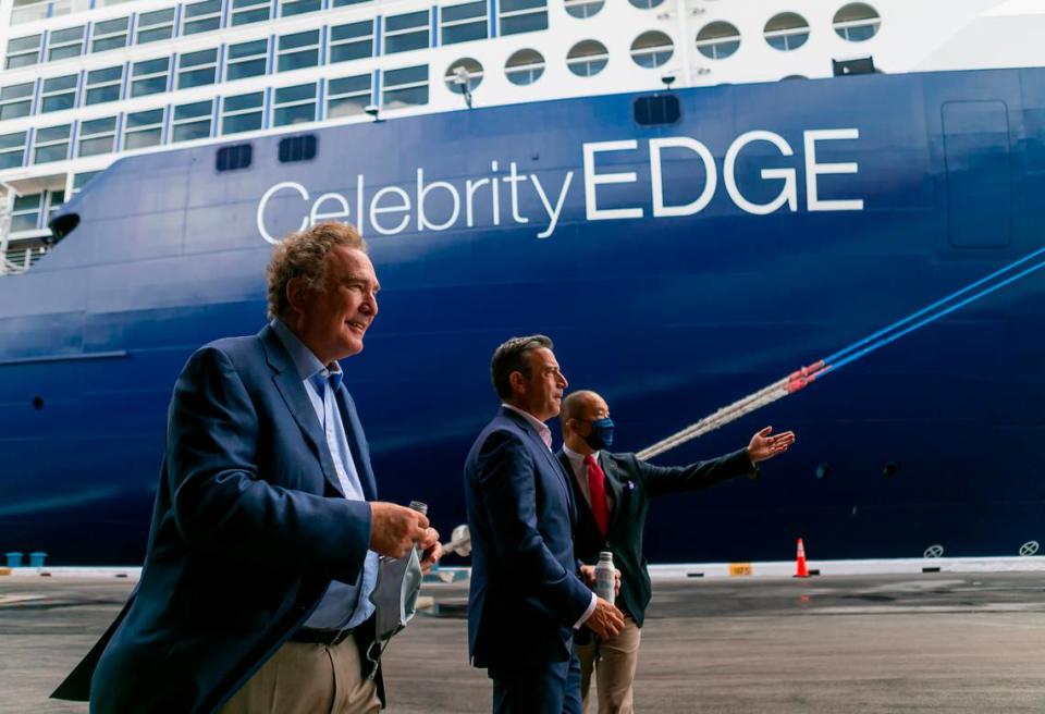 Richard Fain, Chairman and CEO of Royal Caribbean Group, far-left, and Brian Abel, Senior Vice President of Hotel Operations with Celebrity Cruises, center, make their way to the front of Royal Caribbean’s Celebrity Edge cruise ship docked at Port Everglades in Fort Lauderdale, Florida on Saturday, June 26, 2021. After departing Port Everglades Saturday, Royal Caribbean’s Celebrity Edge will be the first cruise ship sailing with guests from a U.S. port in over 15 months.
