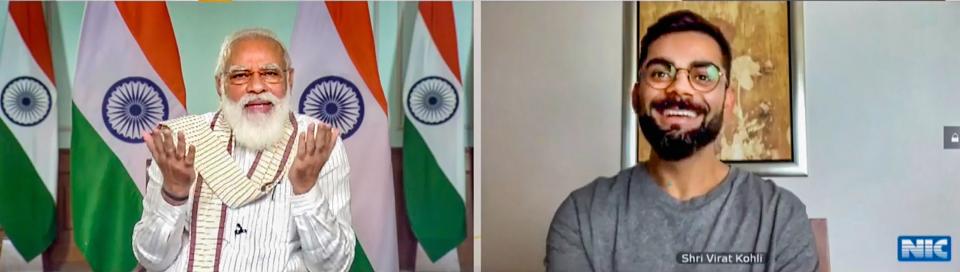 **EDS: SCREENSHOT FROM A VIDEO POSTED BY @narendramodi ON THURSDAY, SEPT. 24, 2020** New Delhi: Prime Minister Narendra Modi virtually interacts with Indian cricket team captain Virat Kohli during Fit India Dialogue on the first anniversary of Fit India Movement, in New Delhi. (PTI Photo)(PTI24-09-2020_000041B)