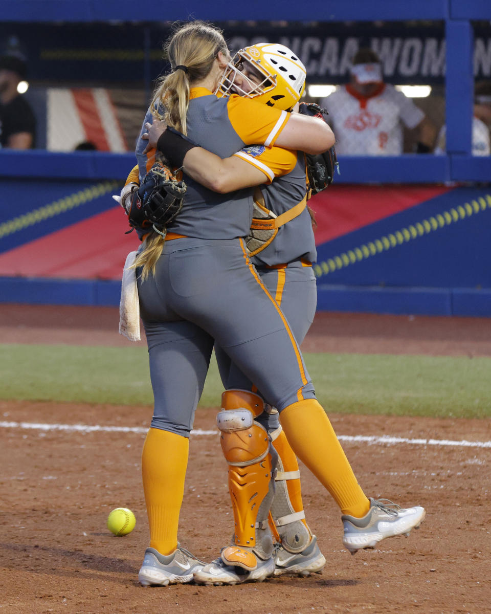 Tennessee pitcher Ashley Rogers, left, and catcher Giulia Koutsoyanopulos celebrate a win over Oklahoma State in an NCAA softball Women's College World Series game, Sunday, June 4, 2023, in Oklahoma City. (AP Photo/Nate Billings)