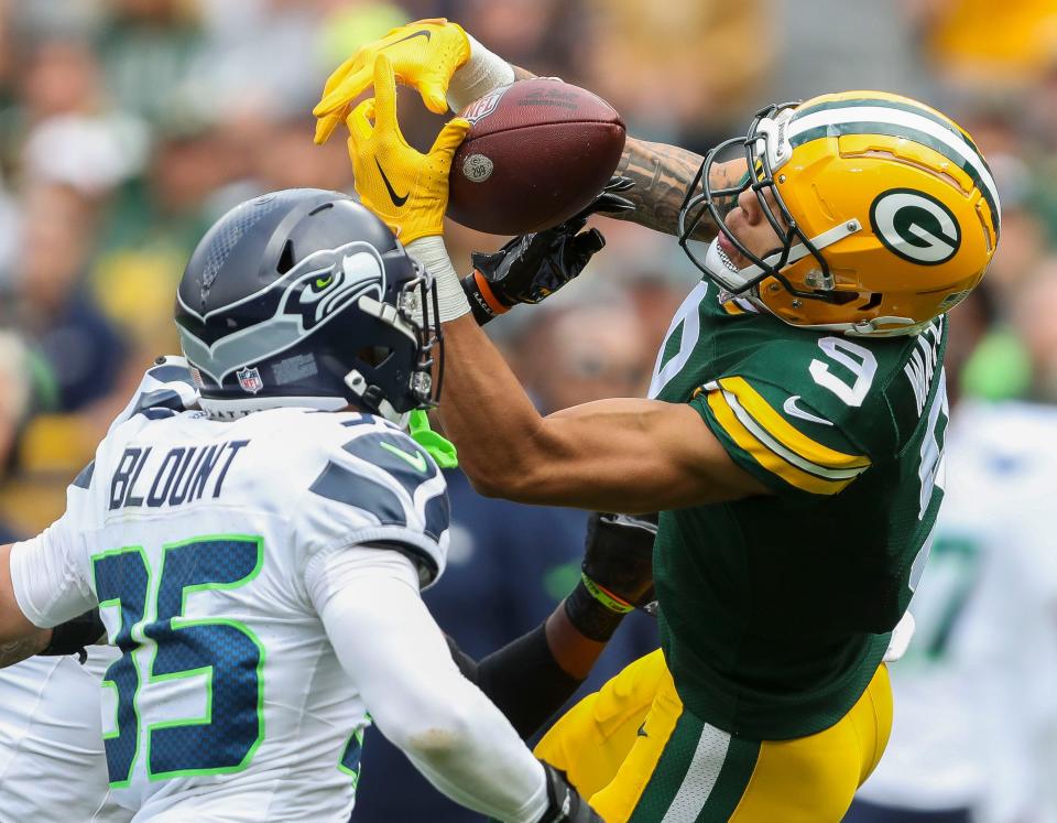 Green Bay Packers wide receiver Christian Watson (9) has a pass knocked out of his hands by Seattle Seahawks cornerback Michael Jackson during their preseason football game on Saturday, August 26, 2023, at Lambeau Field in Green Bay, Wis. 
Tork Mason/USA TODAY NETWORK-Wisconsin
