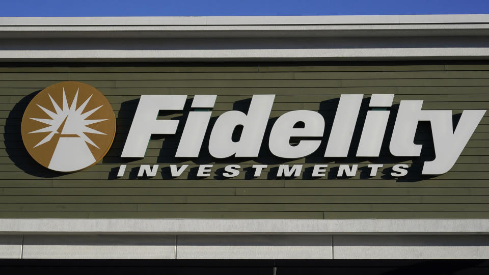 FILE - A Fidelity Investments sign and logo are attached to the outside of a Fidelity Investments office location, Tuesday, Dec. 20, 2022, in Westwood, Mass. Several online brokerage firms including Charles Schwab, Fidelity and Vanguard appeared to be down for thousands of users early Monday, Aug. 5, 2024, during one of the biggest stock markets sell-offs of 2024.(AP Photo/Steven Senne, File)