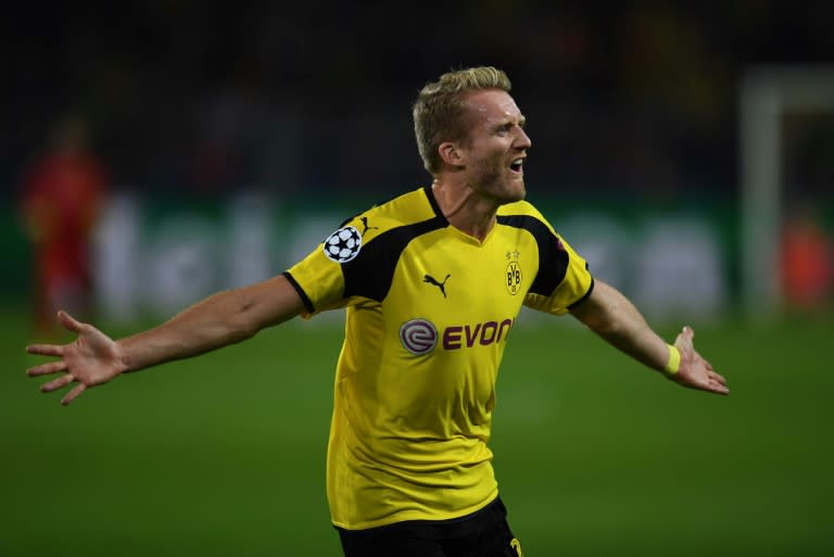 Dortmund's midfielder Andre Schuerrle reacts after scoring against Real Madrid during a UEFA Champions League match on September 27, 2016