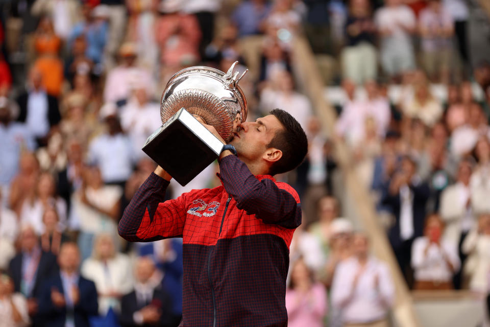 PARIS, FRANCE - JUNE 11: Novak Djokovic of Serbia kisses the winners trophy after victory against Casper Ruud of Norway in the Men's Singles Final match on Day Fifteen of the 2023 French Open at Roland Garros on June 11, 2023 in Paris, France. (Photo by Clive Brunskill/Getty Images)