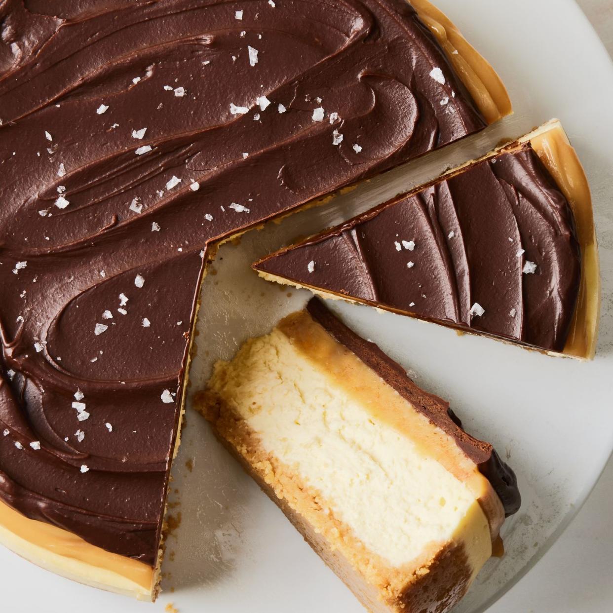 layered shortbread cheesecake covered in chocoalte