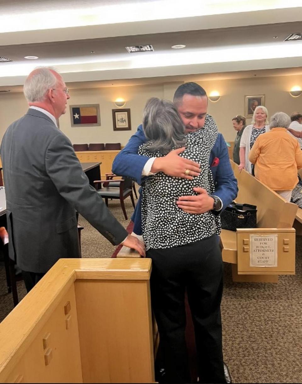 The reaction of Daniel Hammack (left) and his wife after a Tarrant County jury found him not guilty last week of a 2018 murder charge. His wife is shown giving one of their attorneys, Phillip Hall of Fort Worth, a hug.