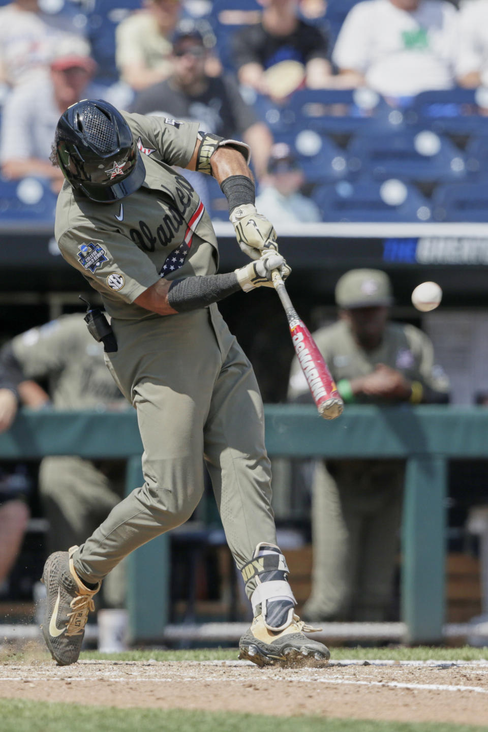 Vanderbilt's Austin Martin hits a two-run home run against Louisville in the seventh inning of an NCAA College World Series baseball game in Omaha, Neb., Sunday, June 16, 2019. (AP Photo/Nati Harnik)