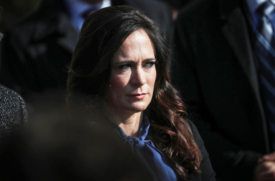 Press Secretary Stephanie Grisham listens to U.S. President Trump as he departs for travel to Georgia at the White House in Washington (Leah Millis / Reuters file)