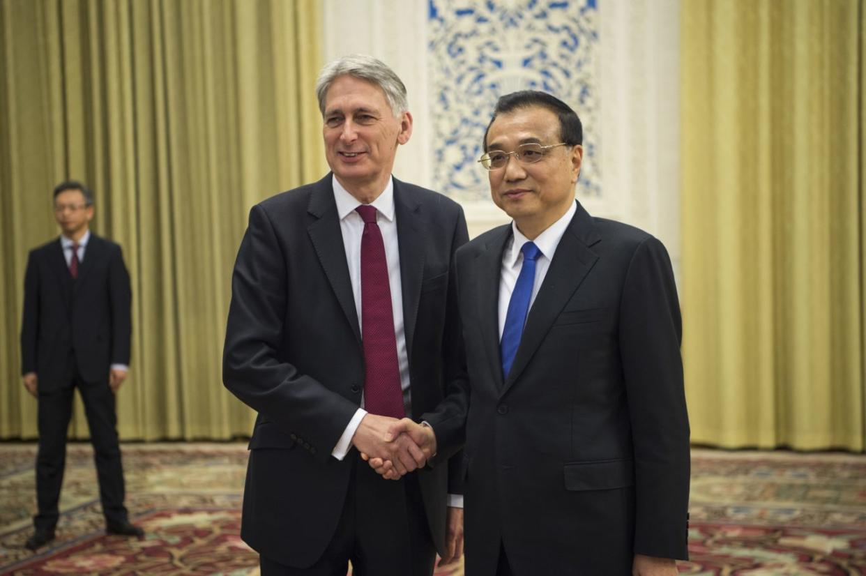 China's Premier Li Keqiang with Chancellor Philip Hammond (Fred Dufour/AP)