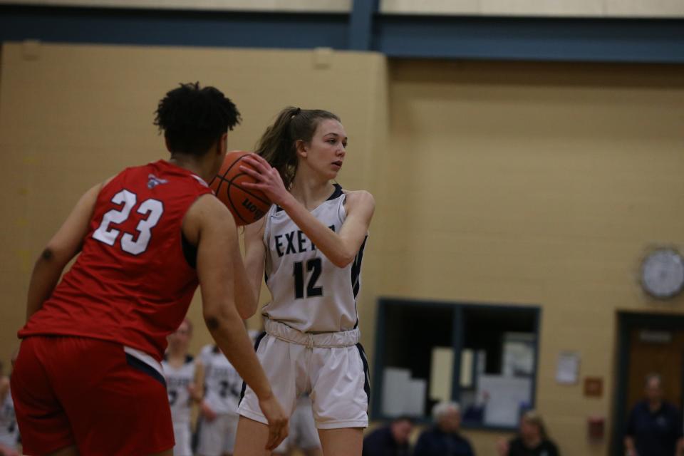 Exeter's Hailey Harrington looks to make a pass to a teammate during Tuesday's loss to Memorial in the first round of the Division I tournament.