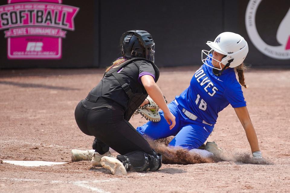 Muscatine's Kyle Salyars (8) attempts to tag out Waukee Northwest's Natalee Watts (18) at home plate during the Class 5A semifinals at Harlan Rogers Sports Complex on Wednesday.