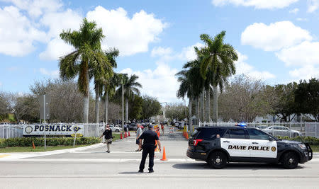 Police vehicles are seen outside the David Posnack Jewish Day School after the second bomb threat in a month was reported in Davie, Florida, U.S. March 7, 2017. REUTERS/Andrew Innerarity