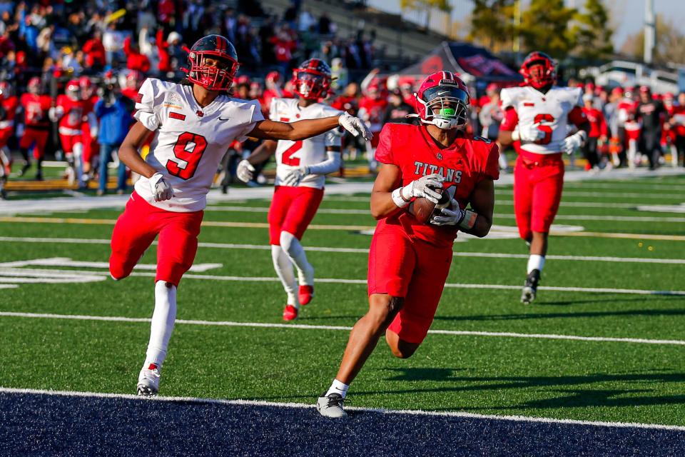 Carl Albert’s Xavier Robinson (21) runs for a touchdown during the 5A high school football state championship game between Carl Albert and Del City at Chad Richison Stadium in Edmond, Okla., on Saturday, Dec. 2, 2023.