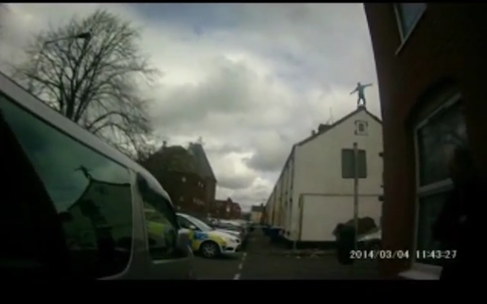 A man high on 'Monkey Dust' prepares to jump off a house and onto a car bonnet below - Staffordshire Police