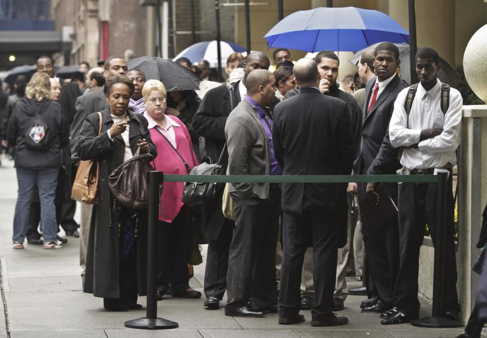 In this Wednesday, Oct. 24, 2012 photo, job seekers wait in line to see employers at the National Career Fairs' job fair in New York. According to government reports released Friday, Nov. 2, 2012, the U.S. economy added 171,000 jobs in October, and the unemployment rate ticked up to 7.9 percent. (AP Photo/Bebeto Matthews)