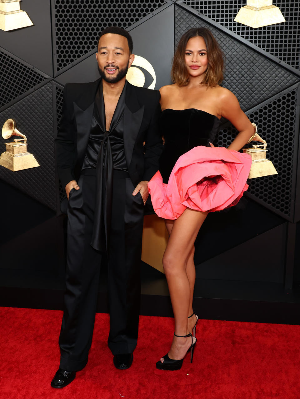 John Legend and Chrissy Teigen at the 2024 Grammys. (Image via Getty Images)