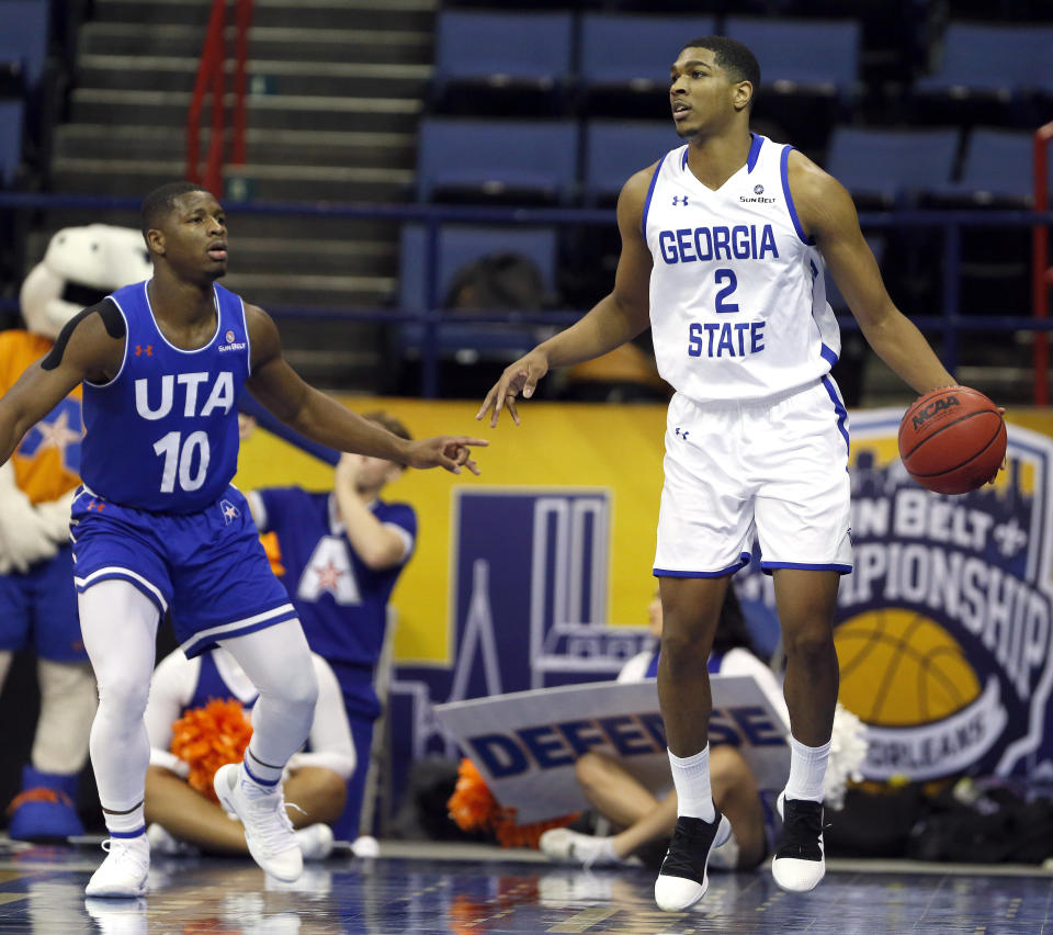 Georgia State forward Malik Benlevi (2) is defended by Texas-Arlington guard Radshad Davis (10) during the first half of an NCAA college basketball game during the championship game of the Sun Belt Conference men's tournament in New Orleans, Sunday, March 17, 2019. (AP Photo/Tyler Kaufman)