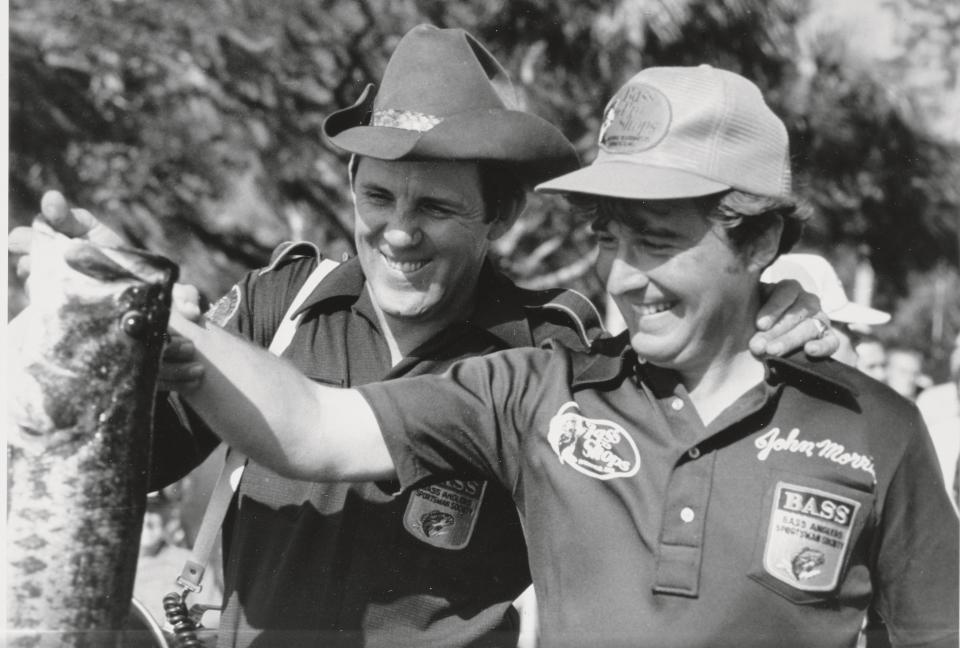 Fishermen Ray Scott and Johnny Morris weigh in a
lunker during the early days of tournament fishing.