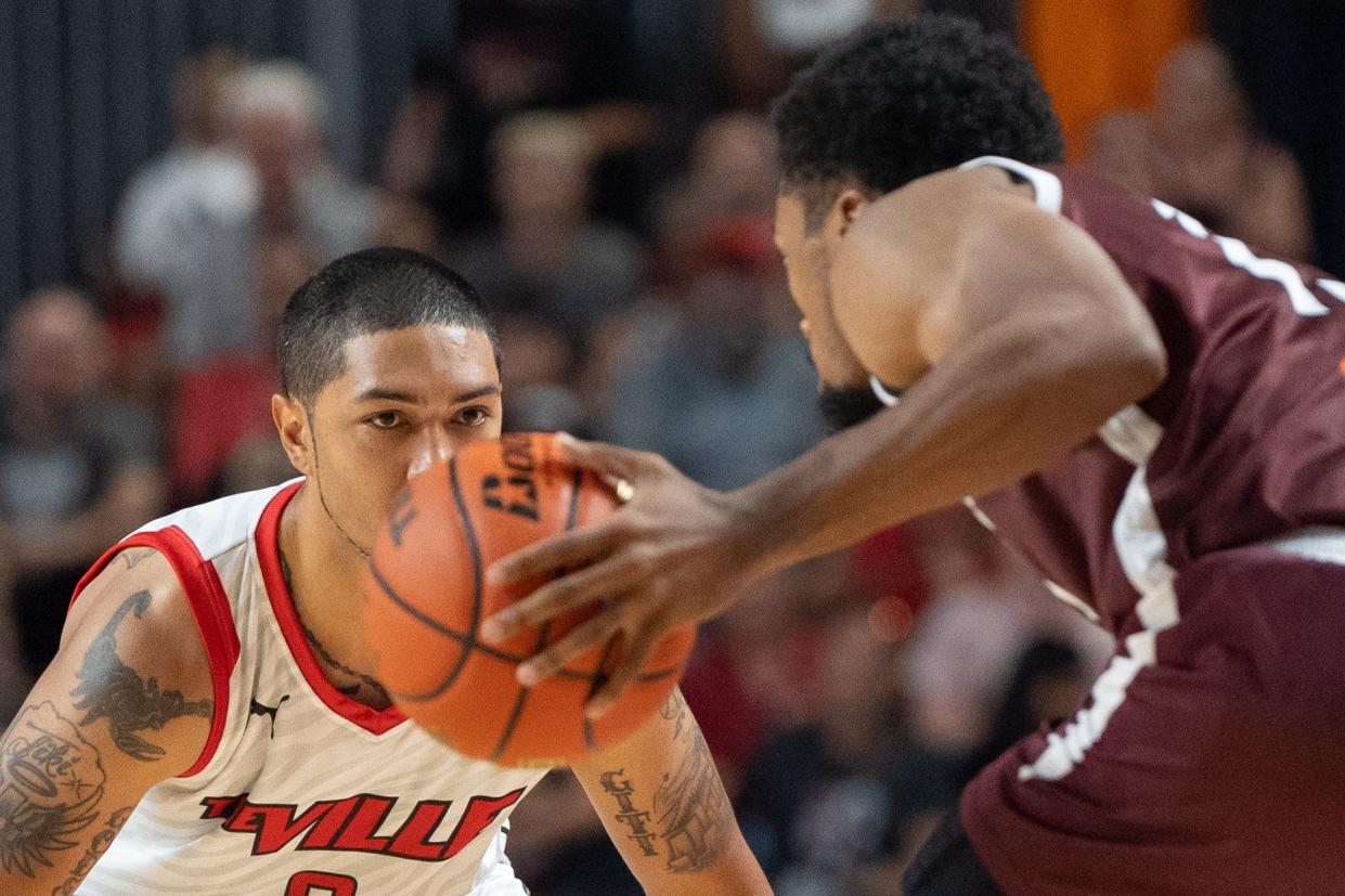 The Ville's Peyton Siva (3) defends the basket against UKnighted's Dylan Penn (13) during their game on Saturday, July 20, 2024 in Louisville, Ky. at Freedom Hall during the first round of The Basketball Tournament.