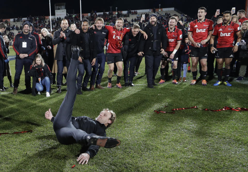 FILE - Crusaders coach Scott Robertson performs a break-dance as celebrates his team's 19-3 win in the Super Rugby final over the Jaguares in Christchurch, New Zealand, on July 6, 2019. Robertson has been appointed as the next All Blacks coach for four years from 2024 through to the end of the 2027 Rugby World Cup and will succeed current All Blacks Head Coach Ian Foster. (AP Photo/Mark Baker, File)