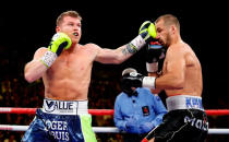 LAS VEGAS, NEVADA - NOVEMBER 02: Canelo Alvarez (L) connects on Sergey Kovalev during a WBO light heavyweight title fight at MGM Grand Garden Arena on November 02, 2019 in Las Vegas, Nevada. (Photo by Steve Marcus/Getty Images)