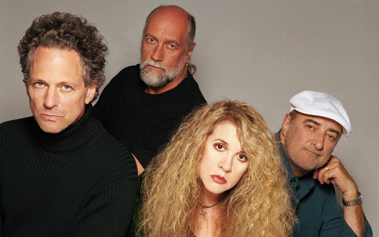 Lindsey Buckingham, far left, pictured in the 1970s with Mick Fleetwood (back left), Stevie Nicks (front) and John McVie (right). Buckingham was kicked out of Fleetwood Mac in 2018 - AP