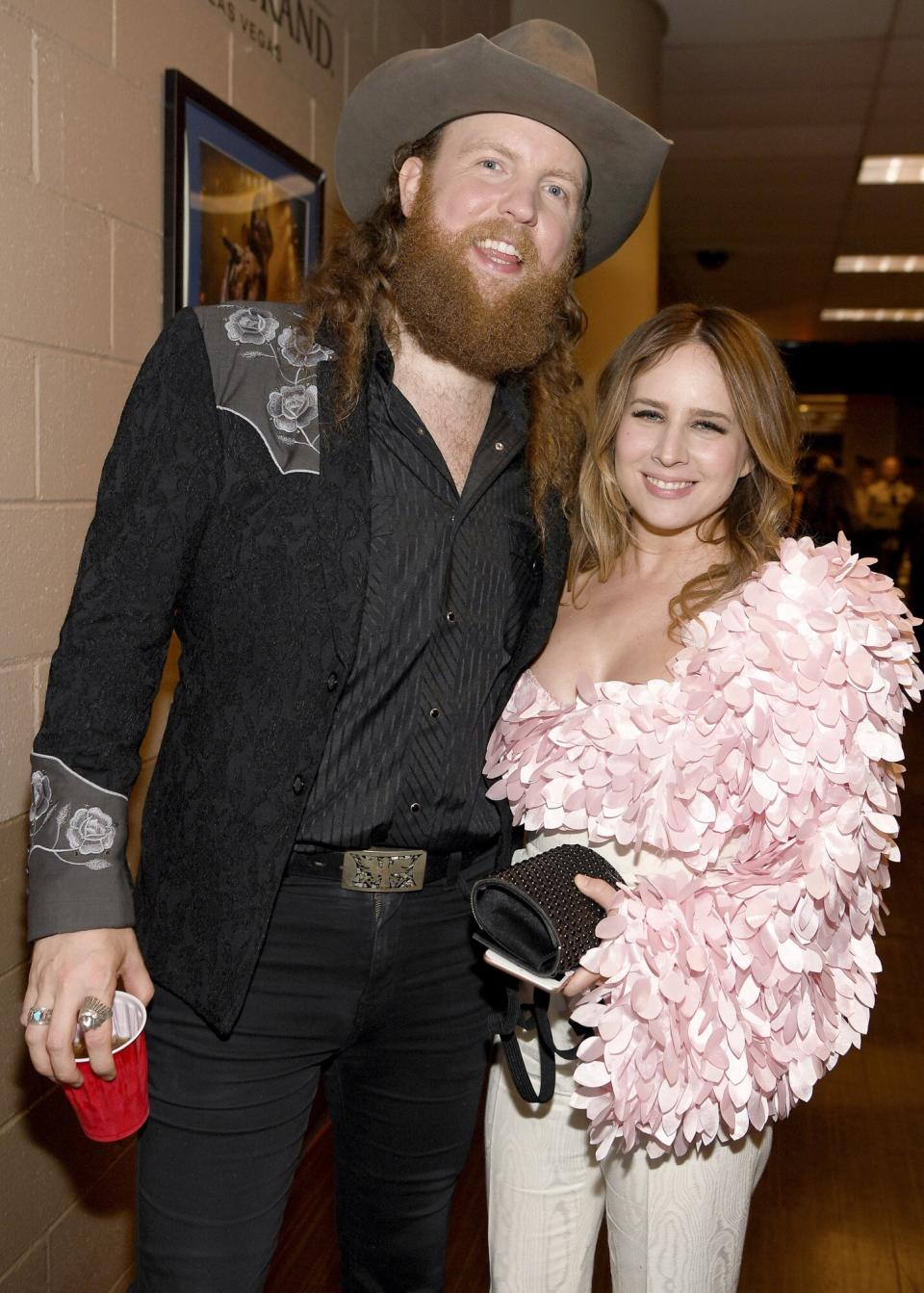 John Osborne of Brothers Osborne and Lucie Silvas attend the 54th Academy Of Country Music Awards at MGM Grand Garden Arena on April 07, 2019 in Las Vegas, Nevada