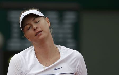 Maria Sharapova of Russia reacts during her women's singles match against Lucie Safarova of the Czech Republic during the French Open tennis tournament at the Roland Garros stadium in Paris, France, June 1, 2015. REUTERS/Gonzalo Fuentes