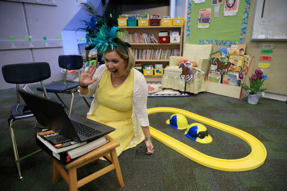 Joann Collins Brock, a Kentucky second-grade teacher, kept a classroom tradition going during the coronavirus pandemic last spring, livestreaming for her students the annual “Run for the Roaches,” a play on the Kentucky Derby, featuring Madagascar hissing cockroaches that are class pets. (Photo by Andy Lyons/Getty Images)