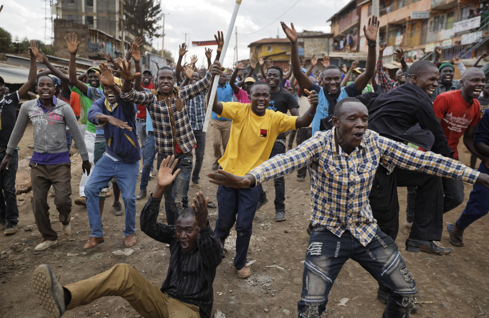 <p>Protesters who had been engaged all day in clashes with riot police, erupt in celebration after hearing news from an opposition press conference which they interpreted as meaning opposition leader Raila Odinga would become president, in the Kawangware slum of Nairobi, Kenya Thursday, Aug. 10, 2017. Kenyan opposition official Musalia Mudavadi claimed Thursday that election commission data shows Odinga won Tuesday’s election and that he should be declared president. (Photo: Ben Curtis/AP) </p>