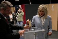 French President Emmanuel Macron's wife Brigitte Macron casts her ballot during the final round of the country's parliamentary elections