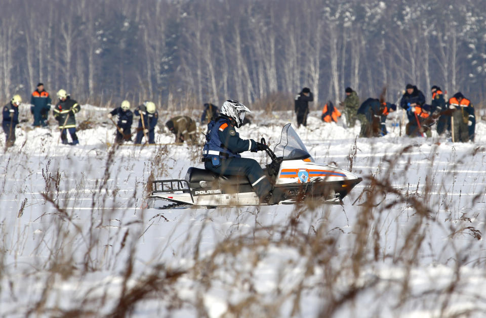 <p>Russian Emergency Situations Ministry employees and Russian police officers work at the scene of a AN-148 plane crash in Stepanovskoye village, about 40 kilometers (25 miles) from the Domodedovo airport, Russia, Feb. 12, 2018. (Photo: Alexander Zemlianichenko/AP) </p>