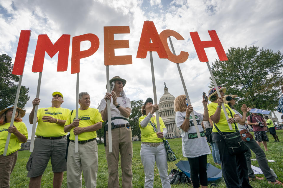 Activists rally for the impeachment of President Donald Trump, at the Capitol in Washington, Thursday, Sept. 26, 2019. Speaker of the House Nancy Pelosi, D-Calif., committed Tuesday to launching a formal impeachment inquiry against Trump. (AP Photo/J. Scott Applewhite)