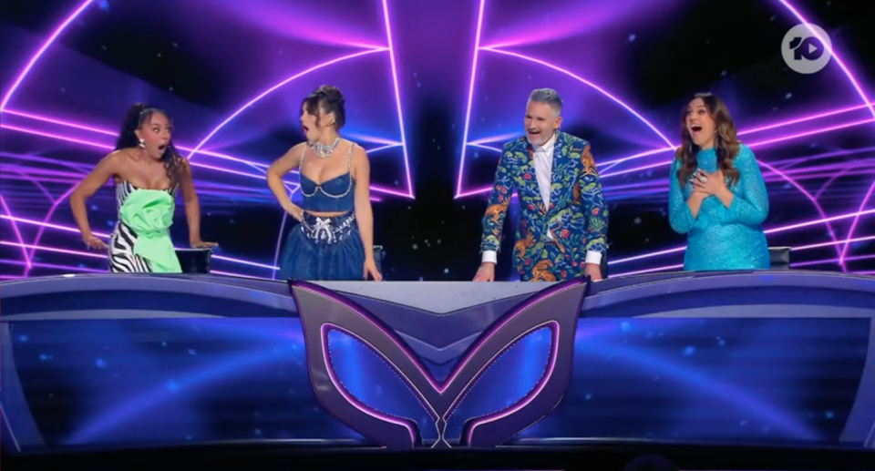 The Masked Singer panel looking shocked.