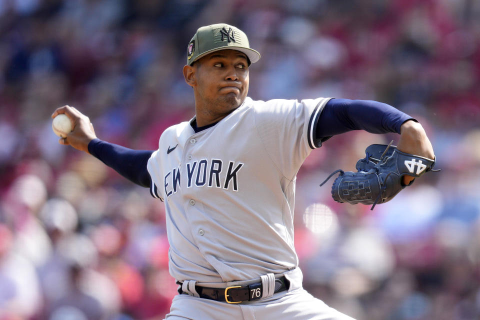 New York Yankees starting pitcher Jhony Brito throws against the Cincinnati Reds in the first inning of a baseball game in Cincinnati, Saturday, May 20, 2023. (AP Photo/Jeff Dean)