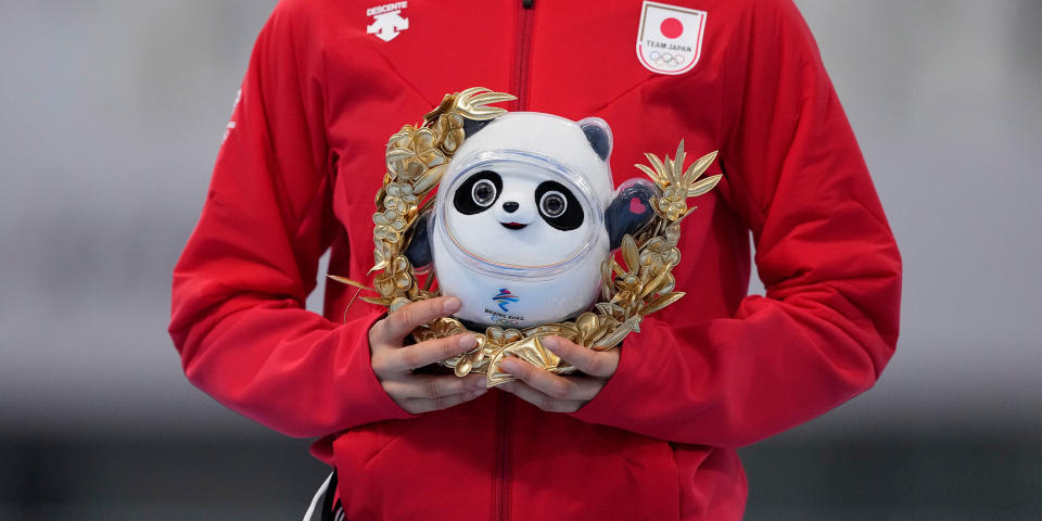 A stuffed mascot Bing Dwen Dwen stands in for a medal. (AP)