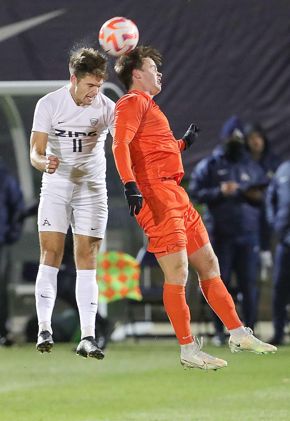 University of Akron's Will Jackson, left, and BGSU's Kyle Cusimano go up after a head ball on Monday, Oct. 17, 2022 in Akron, Ohio, at FIrstEnergy Stadium.