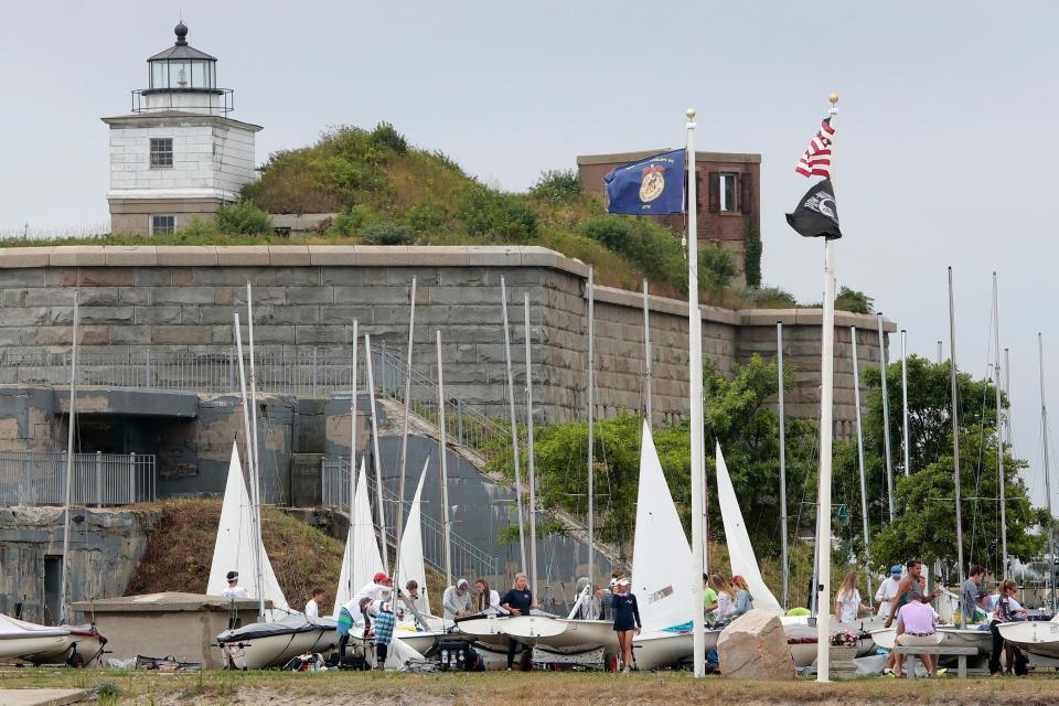 Fort Rodman can be seen in the background as boaters prepare for the 420 North American Championship hosted by the Community Boating Center, out of Fort Taber Park in the south end of New Bedford.