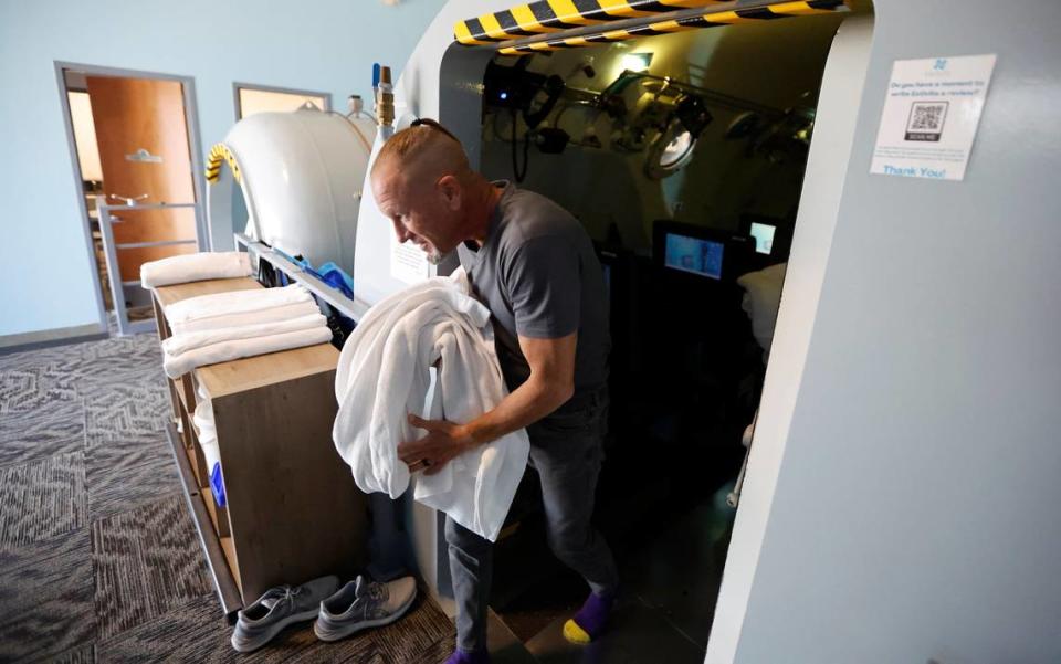 Simon LeMay, a Marine Corps veteran, leaves a hyperbaric oxygen chamber after a session at Extivita in Durham, N.C., on Sept. 22, 2022. LeMay said he came back from his military deployments broken and suicidal and the hyperbaric oxygen treatments “has absolutely changed my life.”