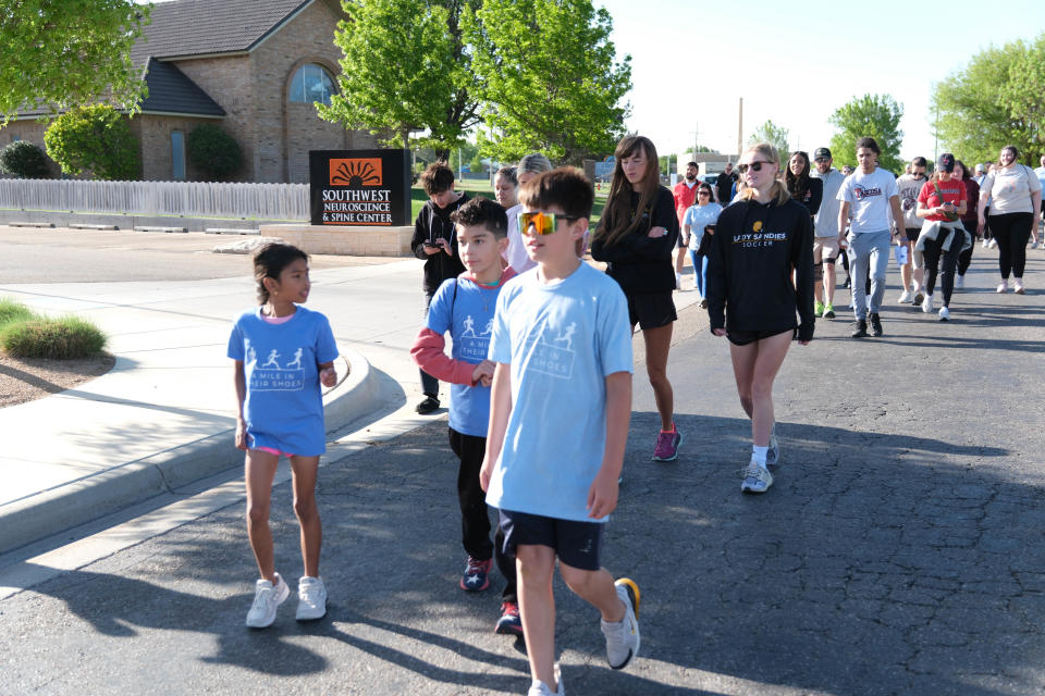 A group of Children participate in the "Walk a Mile in Their Shoes,” a one-mile run/walk event at The Bridge Children's Advocacy Center in Amarillo on Saturday.