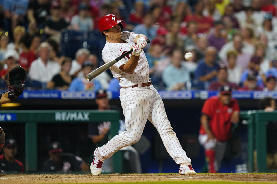 Philadelphia Phillies' J.T. Realmuto hits a two-run home run off Washington Nationals' Carl Edwards Jr. during the sixth inning of a baseball game Saturday, Aug. 6, 2022, in Philadelphia. (AP Photo/Matt Rourke)