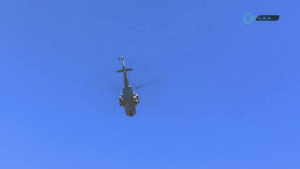 This image made from undated video released by the state-owned Ethiopian News Agency on Monday, Nov. 16, 2020 shows a helicopter in the sky over an area near the border of the Tigray and Amhara regions of Ethiopia. Ethiopia's prime minister Abiy Ahmed said in a social media post on Tuesday, Nov. 17, 2020 that "the final and crucial" military operation will launch in the coming days against the government of the country's rebellious northern Tigray region. (Ethiopian News Agency via AP)