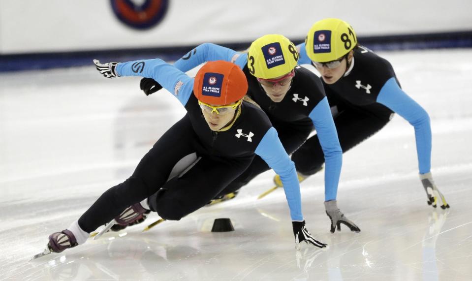 Jessica Smith, left, Emily Scott, center and Alyson Dudek compete in the women's 1,500 meters during the U.S. Olympic short track speedskating trials Friday, Jan. 3, 2014, in Kearns, Utah. (AP Photo/Rick Bowmer)
