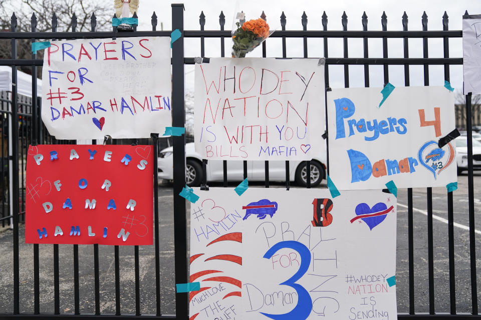 Signs sit along a fence outside UC Medical Center where Buffalo Bills safety Damar Hamiln remains hospitalized, Thursday, Jan. 5, 2023, in Cincinnati. Damar Hamlin has shown what physicians treating him are calling “remarkable improvement over the past 24 hours,” the team announced in a statement on Thursday, three days after the player went into cardiac arrest and had to be resuscitated on the field. (AP Photo/Joshua A. Bickel)